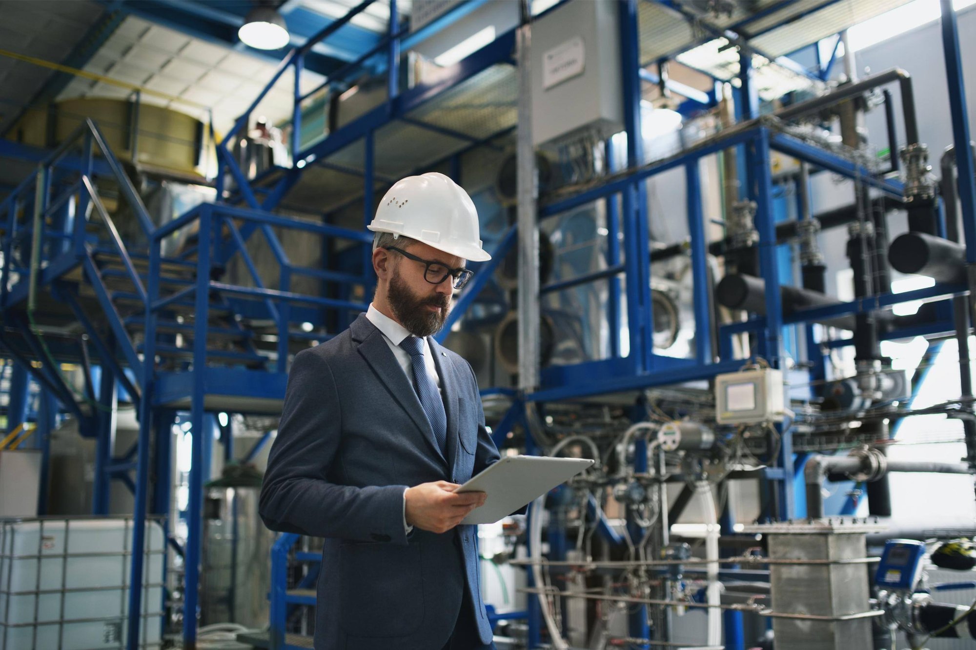 manager looking at metrology reports on a tablet
