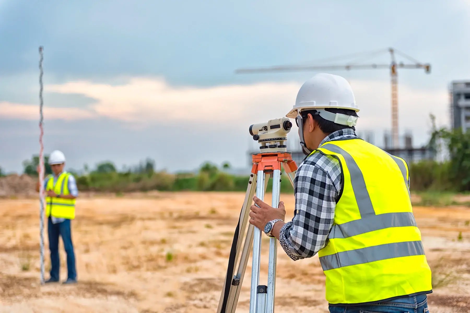 Surveyor equipment. Surveyor’s telescope at construction site or Surveying for making contour plans are a graphical representation of the lay of the land before starting construction