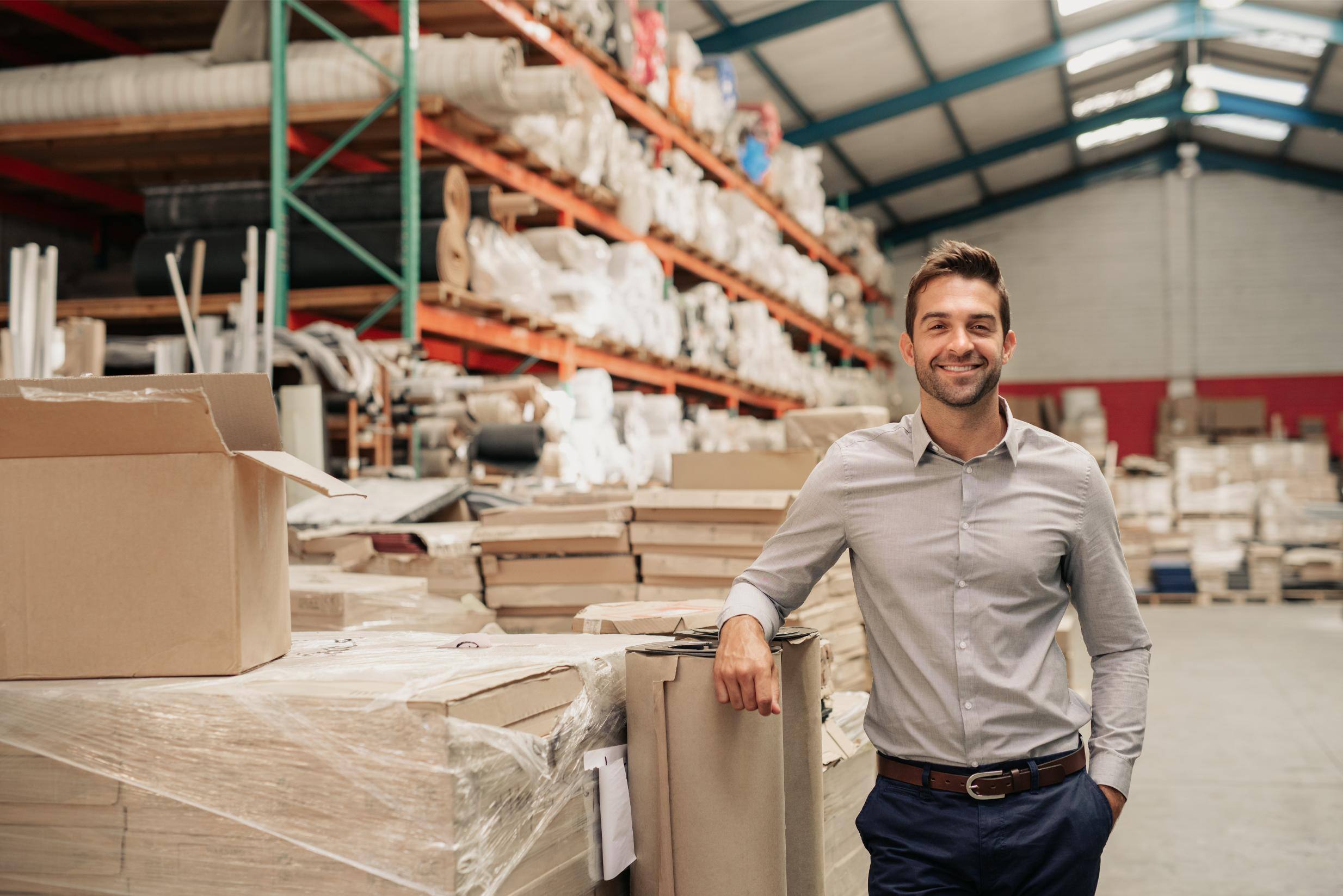 smiling warehouse employee for metrology consulting